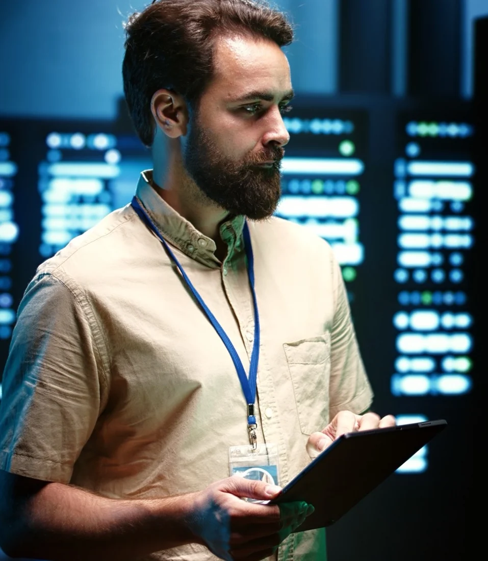 Technician reviewing network equipment